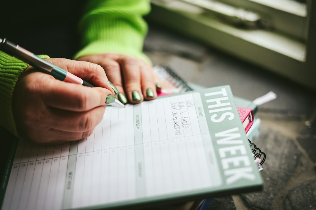 person planning weekly schedule