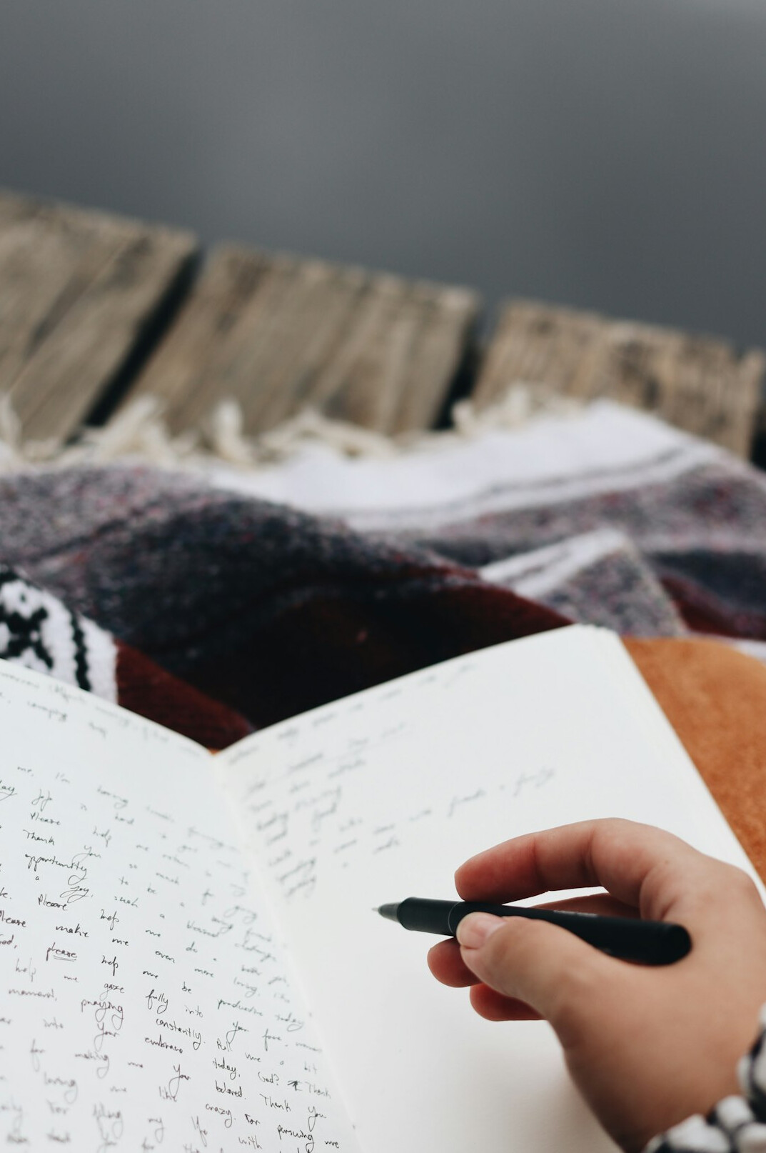 woman writing in productivity journal