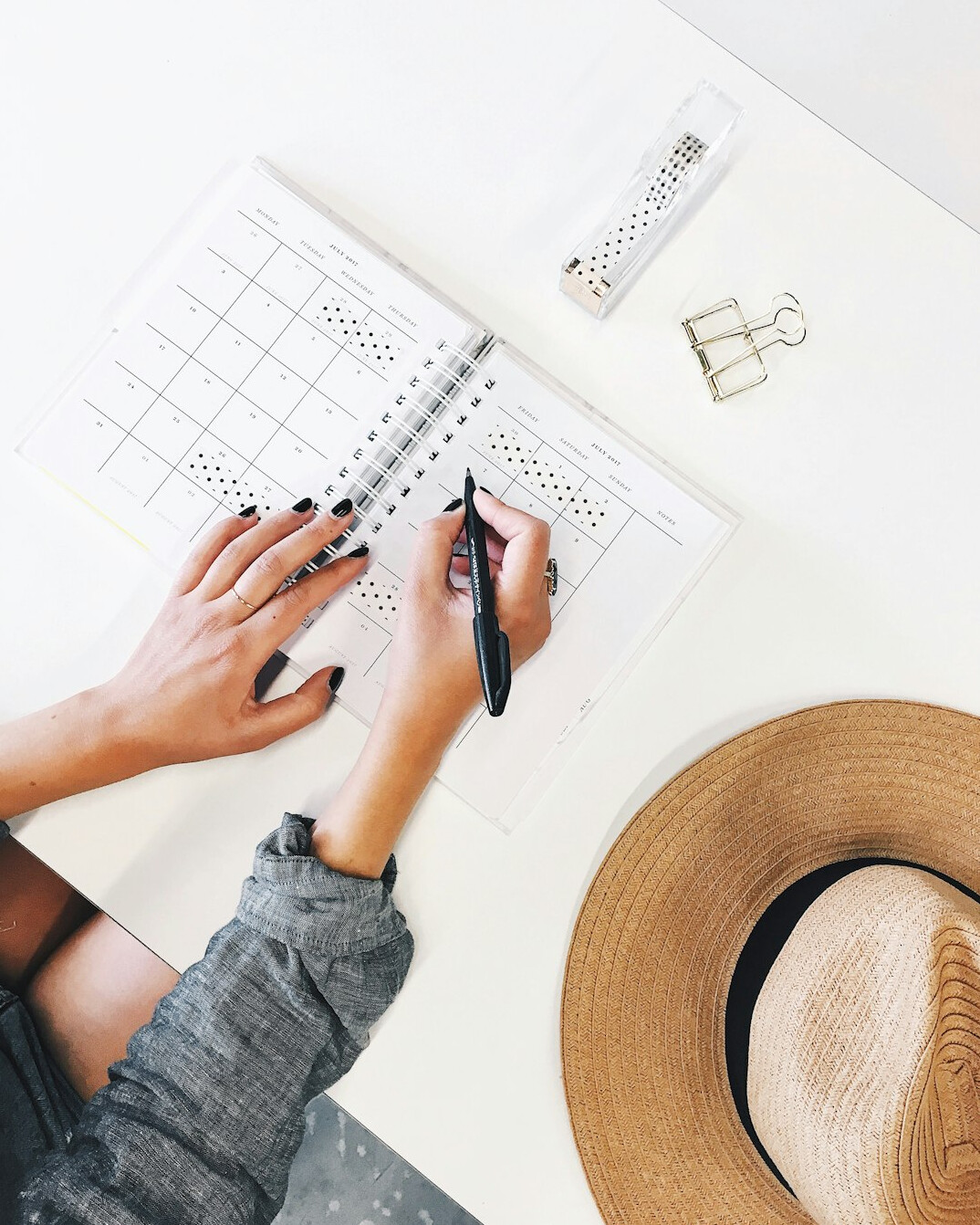 person writing in planner