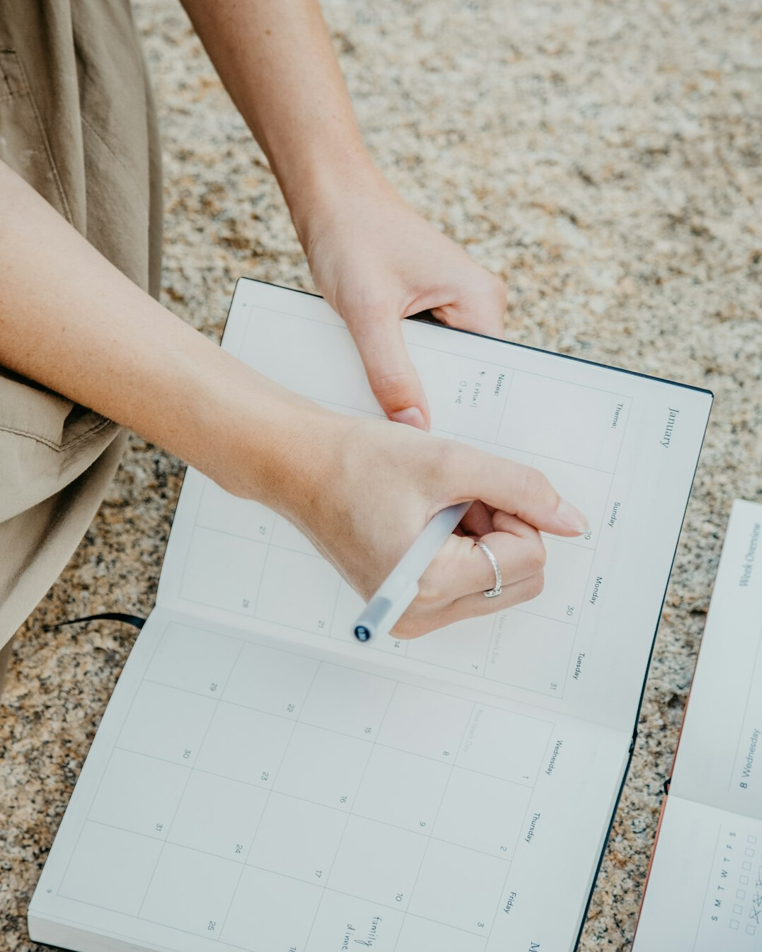 person reviewing calendar and notes